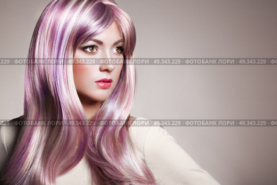 Beauty Fashion Model Girl with Colorful Dyed Hair. Girl with perfect Makeup and Hairstyle. Model with perfect Healthy Dyed Hair. Rainbow Hairstyles. Стоковое фото, агентство Ingram Publishing / Фотобанк Лори