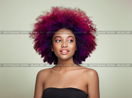 Beauty portrait of African American girl with colorful dyed afro hair. Beautiful black woman. Cosmetics, makeup and fashion. Стоковое фото, агентство Ingram Publishing / Фотобанк Лори
