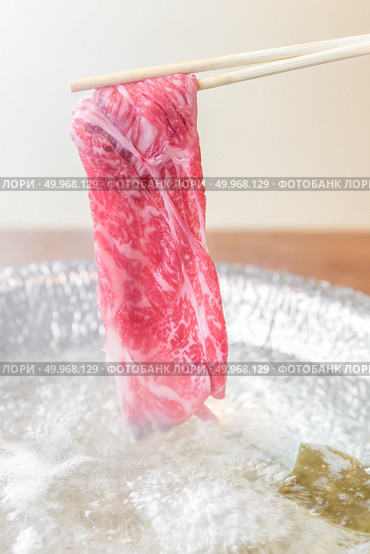 Beef Wagyu A5 Shabu shabu with steam, Groumet Japanese hot pot cuisine. Стоковое фото, агентство Ingram Publishing / Фотобанк Лори