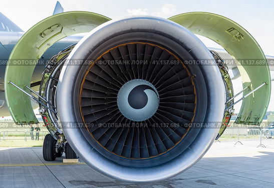 BERLIN, GERMANY - JUNE 03, 2016: Turbofan engine General Electric CF6-80C2 of medical aircraft Airbus A310-304 MRTT MedEvac "August Euler" (Luftwaffe). Close-up. Exhibition ILA Berlin Air Show 2016. Редакционное фото, фотограф Sergey Kohl / Фотобанк Лори