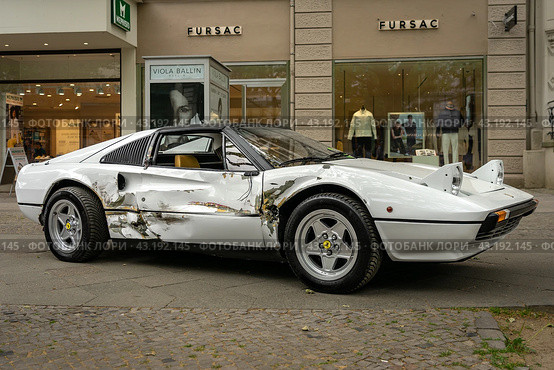 BERLIN - MAY 04, 2024: The sports car Ferrari 308 GTS with a broken body after a car accident. Classic Days Berlin 2024. Редакционное фото, фотограф Sergey Kohl / Фотобанк Лори