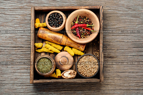 Big set Indian spices and herbs.Food and cuisine ingredients.Spices on a wooden board. Seasonings for food. Стоковое фото, агентство Ingram Publishing / Фотобанк Лори