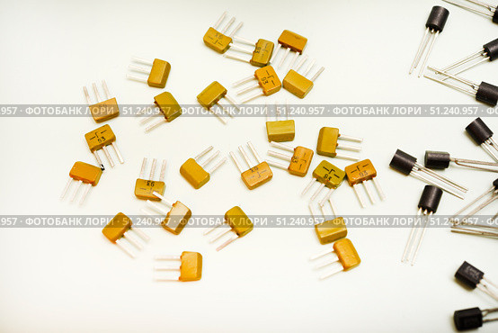 Bipolar transistors on a white background. Semiconductor devices. Microelectronics. Стоковое фото, фотограф Valeriy Lushchikov / Фотобанк Лори