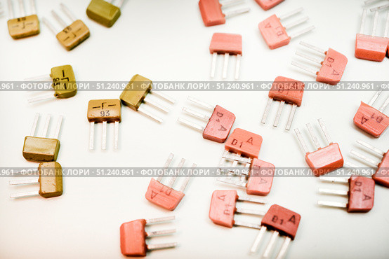 Bipolar transistors on a white background. Semiconductor devices. Microelectronics. Стоковое фото, фотограф Valeriy Lushchikov / Фотобанк Лори