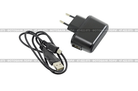 Блок питания на белом фоне. AC/DC adapter  on white background. Стоковое фото, фотограф Татьяна Д / Фотобанк Лори