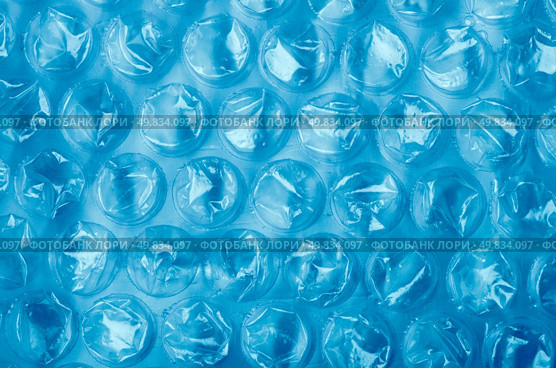 Blue Plastic bubble wrap pattern closeup. Стоковое фото, агентство Ingram Publishing / Фотобанк Лори