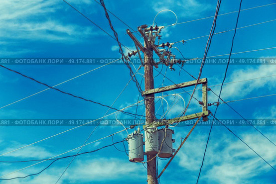blur  in  philippines   a electric pole with transformer and wire  the cloudy sky. Стоковое фото, агентство Ingram Publishing / Фотобанк Лори