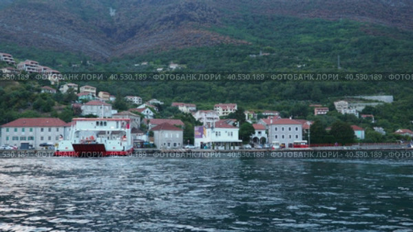 Boka Kotor Adriatic Sea, Verige Strait Kamenari Lepetane Ferry Line Trajekt. Ferryboat for passenger, cargo and vehicles. Tourism and business in Montenegro. Maritime transport coastal. August 16 2022. Стоковое видео, видеограф Юлия Петровская / Фотобанк Лори