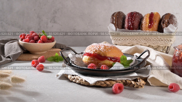 Bolas de Berlim, or "Berlin Balls". Portuguese fried dough with sugar, Filled with sweet cream. Стоковое фото, агентство Ingram Publishing / Фотобанк Лори