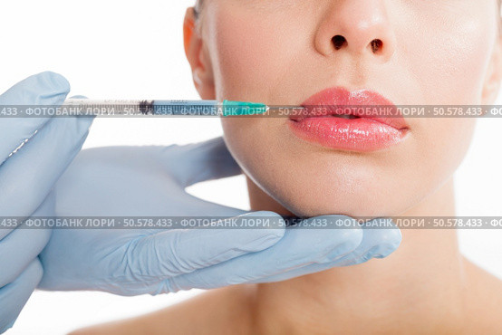 Botox shot in the female cheek, Стоковое фото, агентство Ingram Publishing / Фотобанк Лори