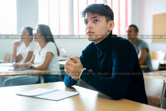 Boy focused on lecture in university. Стоковое фото, фотограф Яков Филимонов / Фотобанк Лори