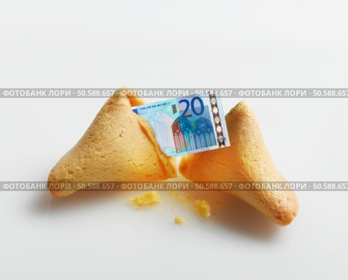 Broken fortune cookie with Euro inside. 24316791. Стоковое фото, агентство Ingram Publishing / Фотобанк Лори