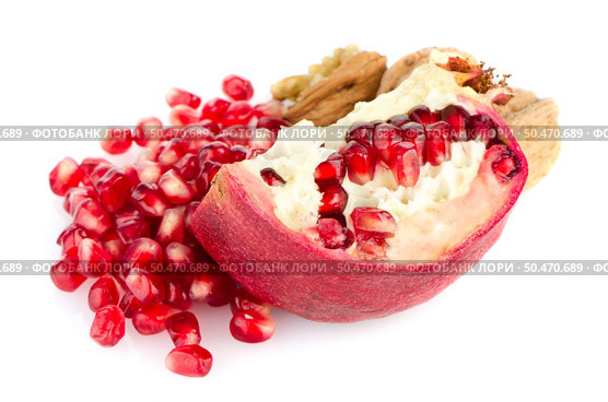 Broken half pomegranate fruit on white background. Стоковое фото, агентство Ingram Publishing / Фотобанк Лори