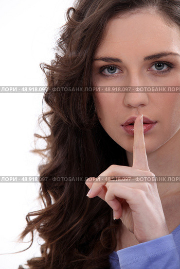 Brunette asking for quiet. Стоковое фото, агентство Ingram Publishing / Фотобанк Лори
