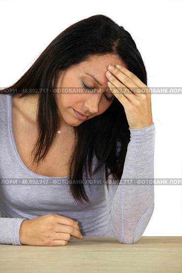 Brunette suffering from migraine. Стоковое фото, агентство Ingram Publishing / Фотобанк Лори