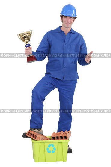 Builder awarded prize for recycling. Стоковое фото, агентство Ingram Publishing / Фотобанк Лори