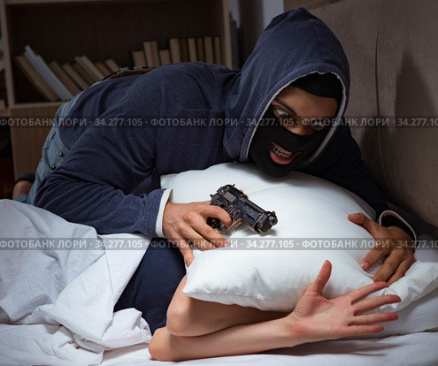 Burglar breaking into house at night to bedroom with sleeping wo. Стоковое фото, фотограф Elnur / Фотобанк Лори