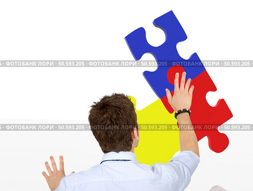 business man making a jigsaw puzzle isolated. Стоковое фото, агентство Ingram Publishing / Фотобанк Лори