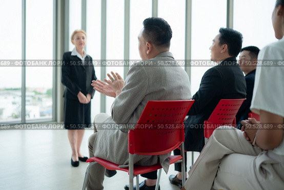 Business people having a meeting in the office discuss plans and successful team work. Стоковое фото, агентство Ingram Publishing / Фотобанк Лори