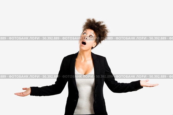 Business woman trying to catch something falling from the sky, isolated over a gray brackground. Стоковое фото, агентство Ingram Publishing / Фотобанк Лори