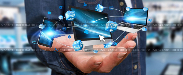 Businessman connecting tech devices computer phone and tablet. Стоковое фото, агентство Ingram Publishing / Фотобанк Лори