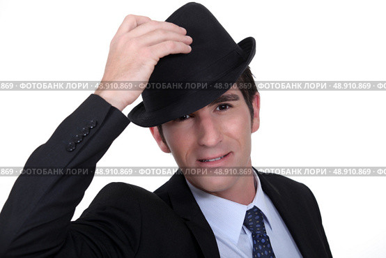 Businessman doffing his hat. Стоковое фото, агентство Ingram Publishing / Фотобанк Лори