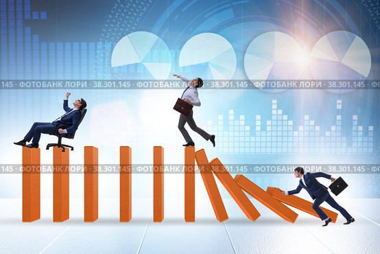 Businessman in domino effect concept. Стоковое фото, фотограф Elnur / Фотобанк Лори
