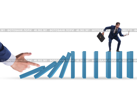 Businessman in domino effect concept. Стоковое фото, фотограф Elnur / Фотобанк Лори