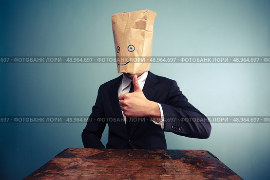 Businessman with paper bag over his head giving thumb up. Стоковое фото, агентство Ingram Publishing / Фотобанк Лори