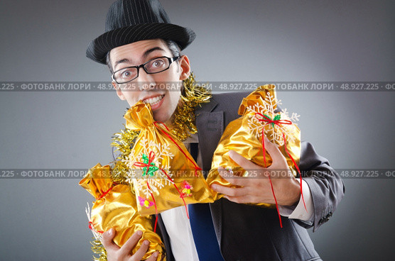Businessman with sacks of presents. Стоковое фото, агентство Ingram Publishing / Фотобанк Лори