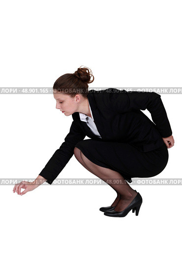 Businesswoman picking up a needle. Стоковое фото, агентство Ingram Publishing / Фотобанк Лори