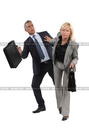 businesswoman pushing a colleague. Стоковое фото, агентство Ingram Publishing / Фотобанк Лори
