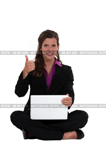 Businesswoman sat cross-legged. Стоковое фото, агентство Ingram Publishing / Фотобанк Лори