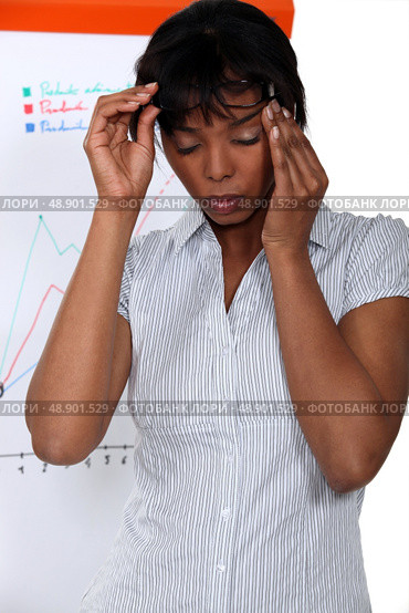 Businesswoman suffering from stress headache. Стоковое фото, агентство Ingram Publishing / Фотобанк Лори