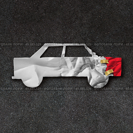 Car repair accident symbol and automobile crash fix concept on an asphalt road with  white crumpled paper shaped as a damaged and dented auto as an icon of insurance and transportation safety issues and bodyshop mechanic repairing. Стоковое фото, агентство Ingram Publishing / Фотобанк Лори