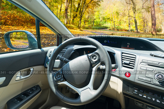 car windscreen with fall road, view inside out. car windscreen with road. Стоковое фото, агентство Ingram Publishing / Фотобанк Лори