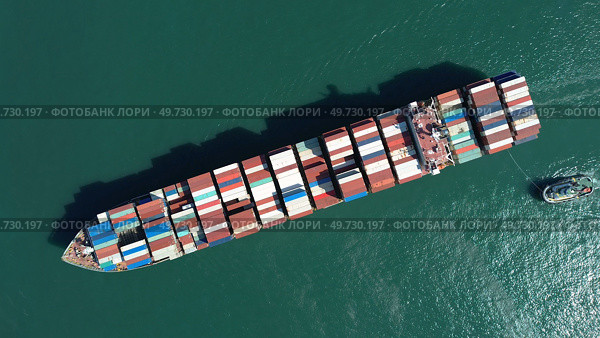 Cargo ship filled with containers in port area. Стоковое фото, фотограф Михаил Коханчиков / Фотобанк Лори