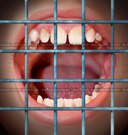 Censorship and free speech concept with a shouting or yelling human mouth behind prison bars as a symbol of a communication ban or banned from communication due to restrictions in the media guidlines and internet police. Стоковое фото, агентство Ingram Publishing / Фотобанк Лори