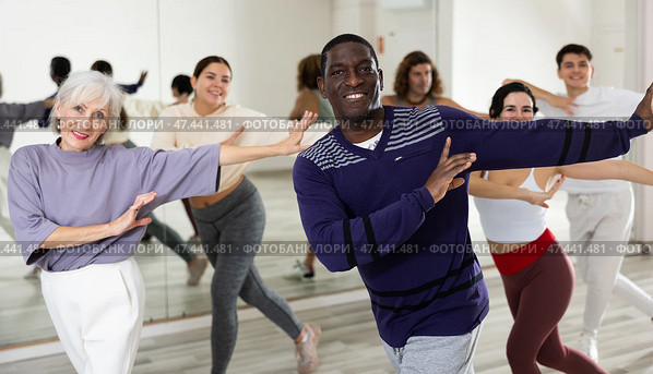 Cheerful african american man enjoying active dancing in studio. Стоковое фото, фотограф Яков Филимонов / Фотобанк Лори