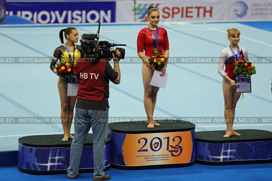 Чемпионат Европы по спортивной гимнастике 2013 года. Москва, СК "Олимпийский". Победители состязаний в индивидуальном многоборье - Алия Мустафина, Лариса Йордаке и Анастасия Гришина. Редакционное фото, фотограф Игорь Долгов / Фотобанк Лори