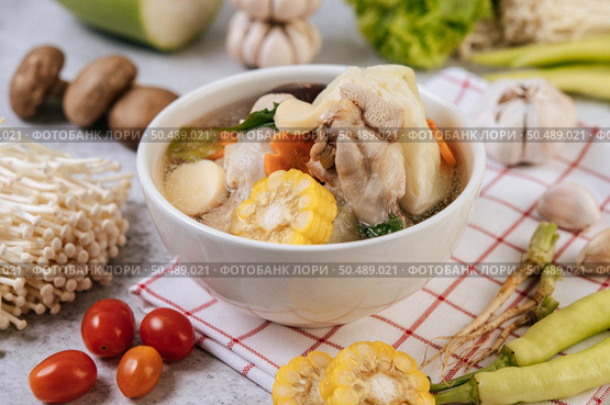 Chicken soup with corn, shiitake mushroom, enoki mushroom, and carrot. Стоковое фото, агентство Ingram Publishing / Фотобанк Лори