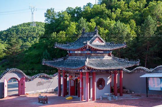 China, Heihe, July 2019: Taoist temple outside the city in Heihe in the summer. Редакционное фото, фотограф Катерина Белякина / Фотобанк Лори