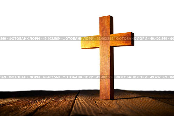 Christian wood cross on white and wooden background. Стоковое фото, агентство Ingram Publishing / Фотобанк Лори