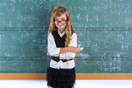 Clever nerd pupil blond girl in green board student schoolgirl. Стоковое фото, агентство Ingram Publishing / Фотобанк Лори