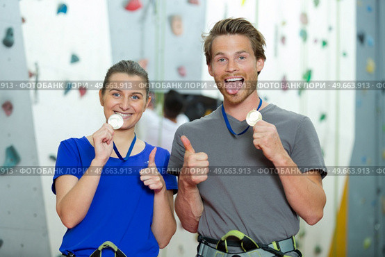 climbers showing off their medals. Стоковое фото, агентство Ingram Publishing / Фотобанк Лори