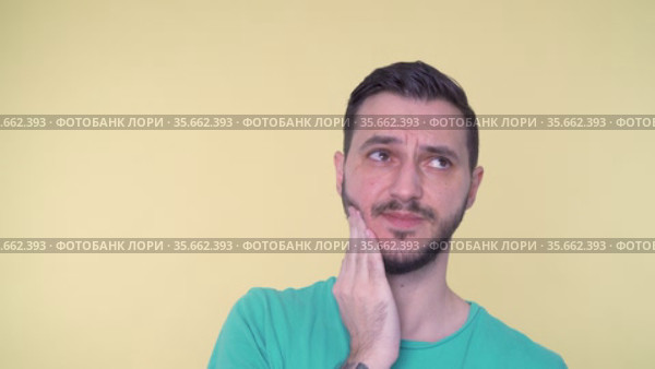 Close Shot Of Young Man With With A Toothache, Suffering and Touching His Cheek. Стоковое видео, видеограф Mihail Mihaylov / Фотобанк Лори