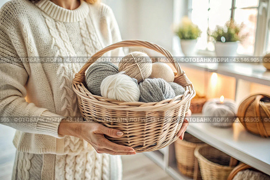 Close-up. A woman with balls of yarn in white and beige tones in her hands. Needlework, knitting. Winter season, small business, handmade clothes. Стоковое AI-изображение, AI-художник Photojuli / Фотобанк Лори