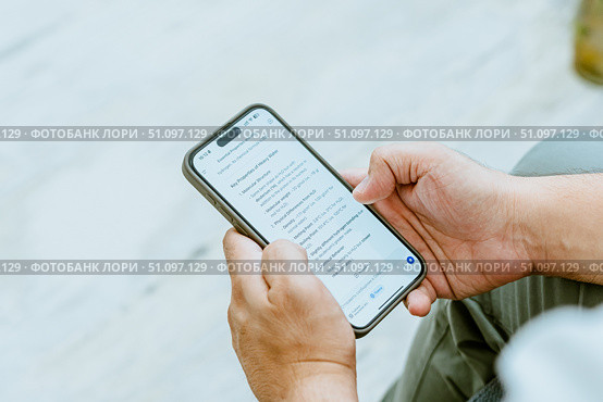 Close-up of a man's hand using AI. Стоковое фото, фотограф Feruza Tashmetova / Фотобанк Лори
