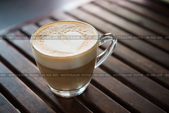 Close up of cappuccino cup with heart shaped milk pattern at caf. Close up of cappuccino cup with heart shaped milk pattern at cafe. a cup of coffee art. Стоковое фото, агентство Ingram Publishing / Фотобанк Лори
