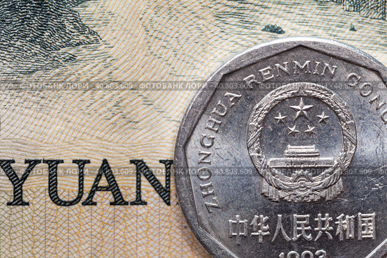 Close-up of Chinese Yuan coin on background of paper banknote. Concept of money, finance, international Asian cooperation, China currency exchange rate, money transactions, trade. Flat lay, macro. Стоковое фото, фотограф Виктория Катьянова / Фотобанк Лори